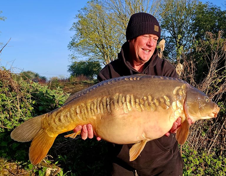 Paul Martin with a large Carper's Retreat mirror carp
